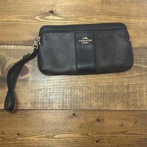 Brown and black Coach wristlet wallet